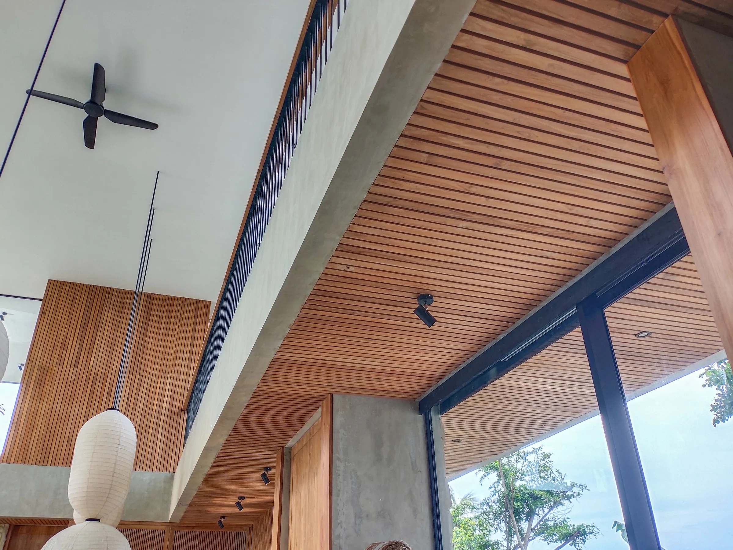 Detail of the slatted teak plank ceiling.