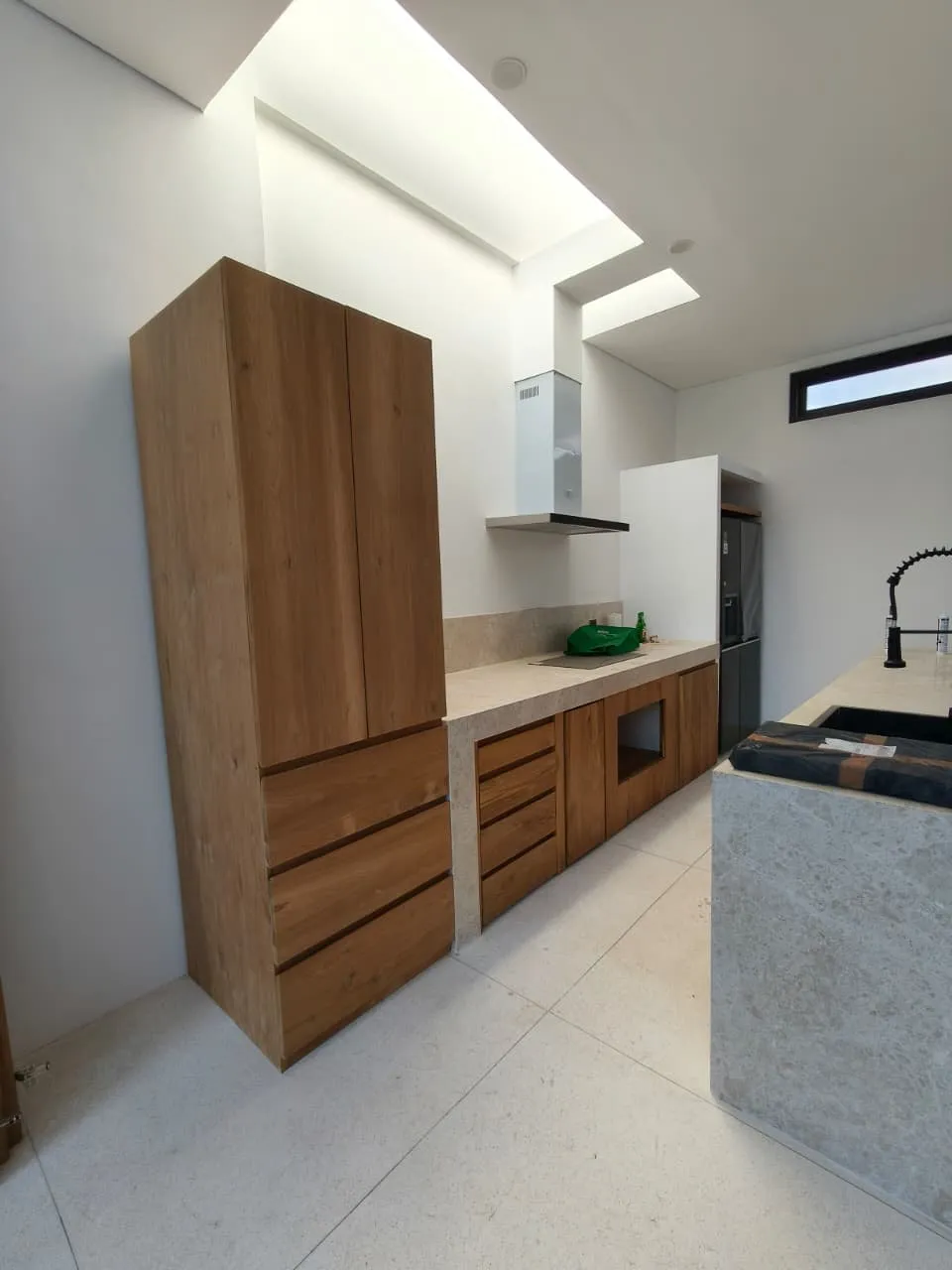 Tall teak kitchen cabinet.